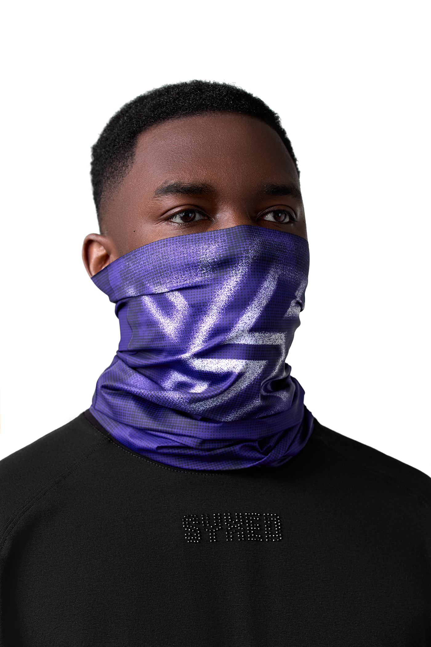 Person wearing a purple reflective neck gaiter against a white background