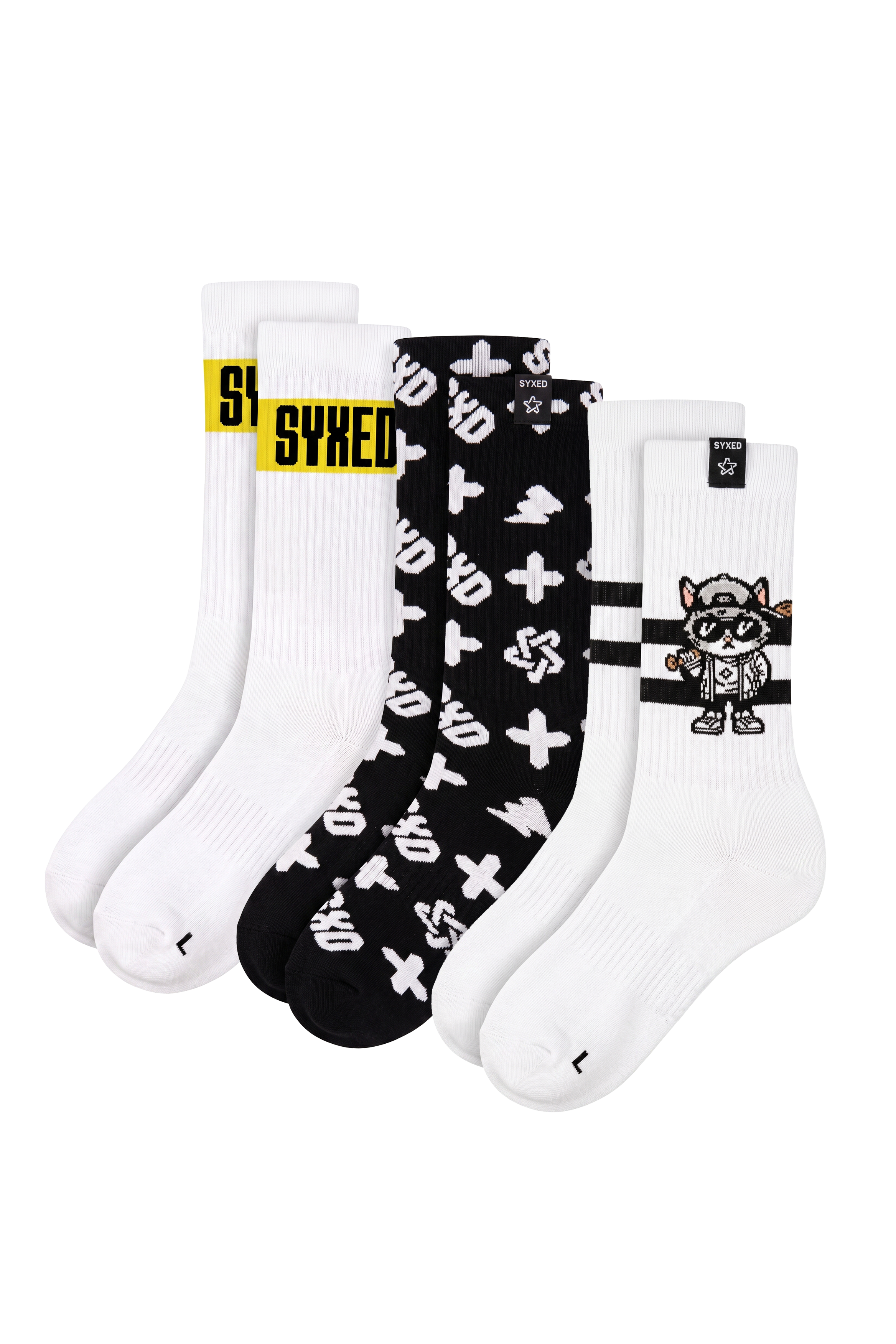A 3-pack of crew socks from SYXED, featuring a white sock with a yellow logo, a black sock with white graffiti-style symbols, and a white sock with a black raccoon graphic.