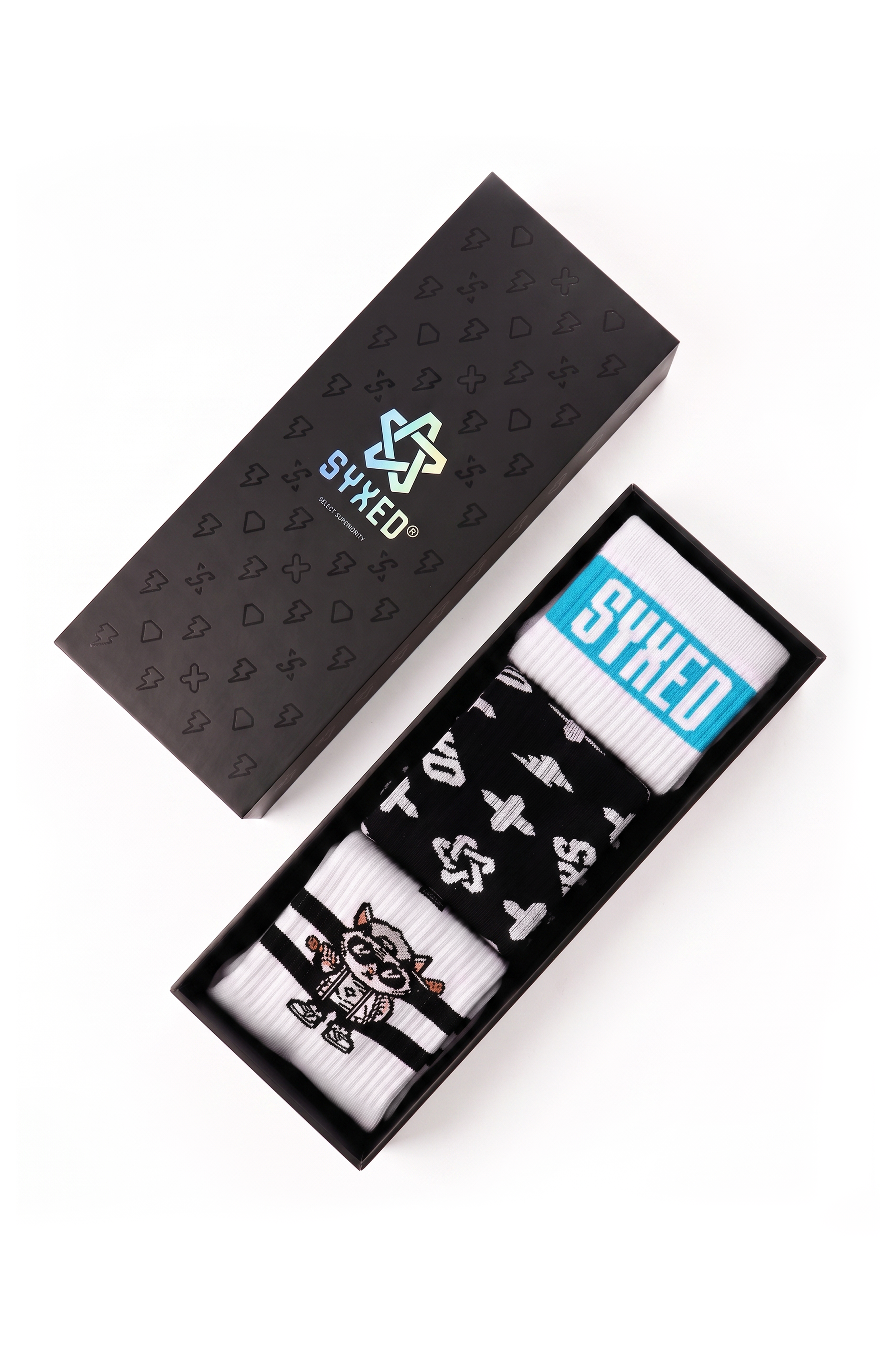 A pair of white and black patterned socks in a black presentation box next to its black branded box lid, on a white background.