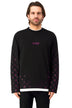 Man wearing a black long-sleeve with purple patterns gems and text 'SYXED' on a white background